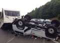 Lucky escape as car towing caravan overturns on M25