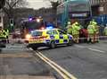 Woman trapped in car following bus crash