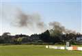 Barbecue blaze destroys sheds and sends smoke into sky