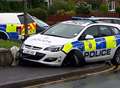Police car crashes on busy road