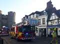 Chimney smashes onto busy shopping street