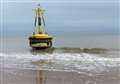 Giant buoy washes up on beach