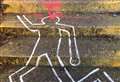 Gory 'dead body' graffiti appears across town