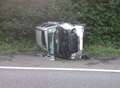 Car overturns after crash with lorry