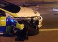 Officer injured as police car crashes into traffic lights