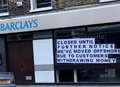 Vandals target bank with giant poster
