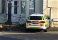 Police car crashes into wall outside house