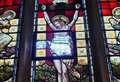 Stained glass window depicting Jesus smashed