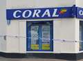 Man arrested after 'hammer robbery' at bookies