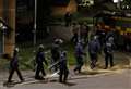 Police in riot gear arrest man over ‘threats’