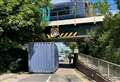 ‘Should’ve gone to Specsavers!’ Lorry hits bridge and drops container