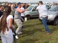 Video: Police called to boot fair punch-up