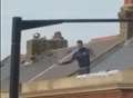 Rooftop protest ends as man arrested