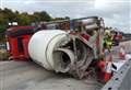 Delays clear after cement mixer overturns