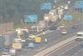 Two people in hospital after car overturns on M20