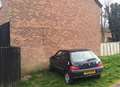 Car smashes into side of house