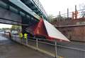 Road closed after lorry hits bridge
