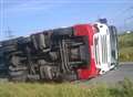 Overturned lorry closes road
