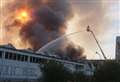 Demolition teams called in as industrial blaze rages on