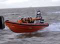 Coastguard rescue teenagers on lilos