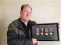 Son's pride at medals for hero dad