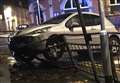 Car ends up embedded in railings