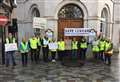 Hi-vis-clad protesters march on town hall