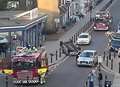 Car flips on roof in town centre