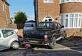 Police hunt driver after runaway truck crashes into driveway