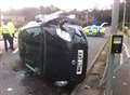Car crashes and overturns in middle of road