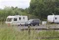 Travellers set up camp in troubled lorry park
