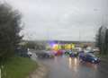Person trapped as car overturns at roundabout