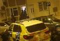Two arrests as armed police storm house