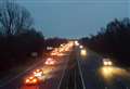 Distressed man on footbridge halts traffic on M20 