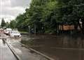 Drivers face flooded road at retail park