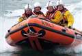 Three rescued as boat drifts under docks' jetty