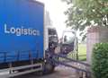 Lorry stuck after snapping memorial arch in two