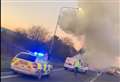 Car fire causes smoke to billow over road