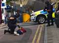 Armed police restrain man 'with weapon'
