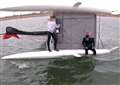 Men stranded in sea on capsized catamaran