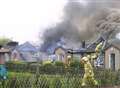 Blaze engulfs row of homes