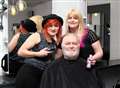 Man shaving head for charity