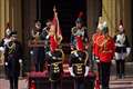 Charles presents flag to mounted cavalry ahead of first birthday parade