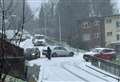 Car hits lamppost as vehicles get ‘stuck’ on snowy hill