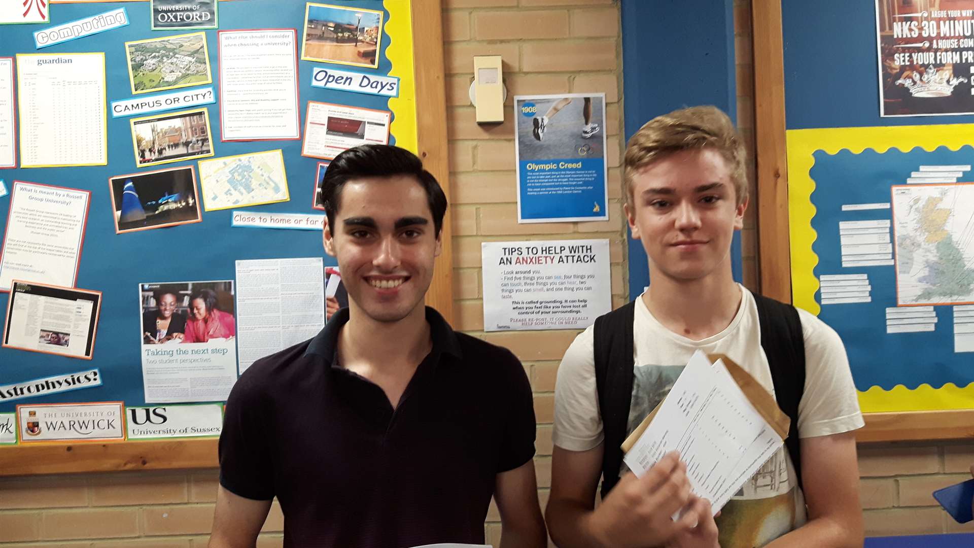 Robbie Dhillon and Giles Manning celebrate success with their GCSE results