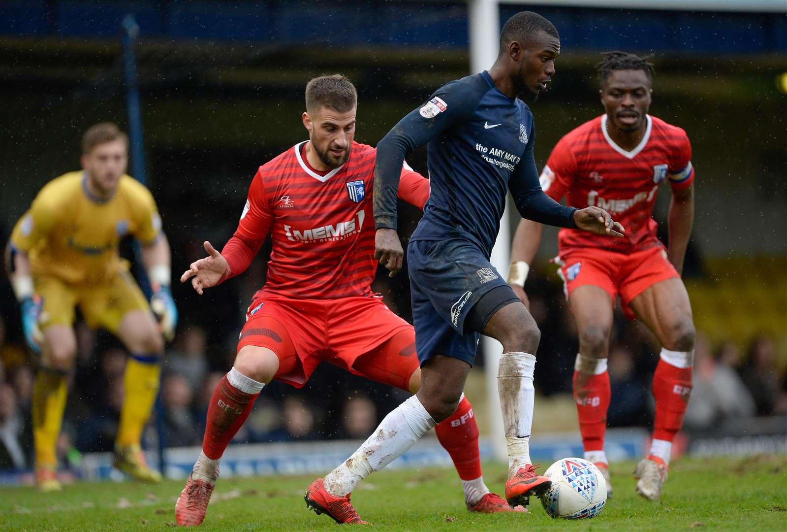 Southend's Theo Robinson up against Max Ehmer and Gabriel Zakuani Picture: Ady Kerry