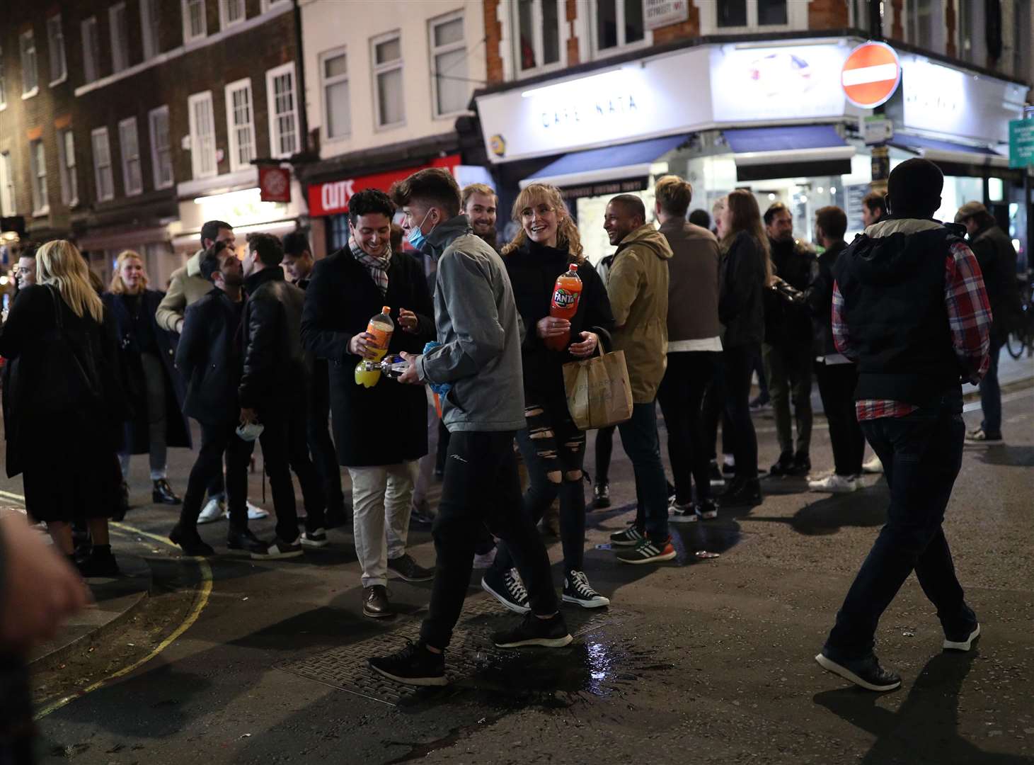 People in Soho after pubs and restaurants were subject to a 10pm curfew (Yui Mok/PA Images).