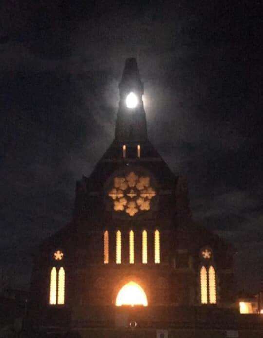 Paula Fagg spotted the moon peeping through the bell tower of the Catholic Church in Sheerness (6715005)