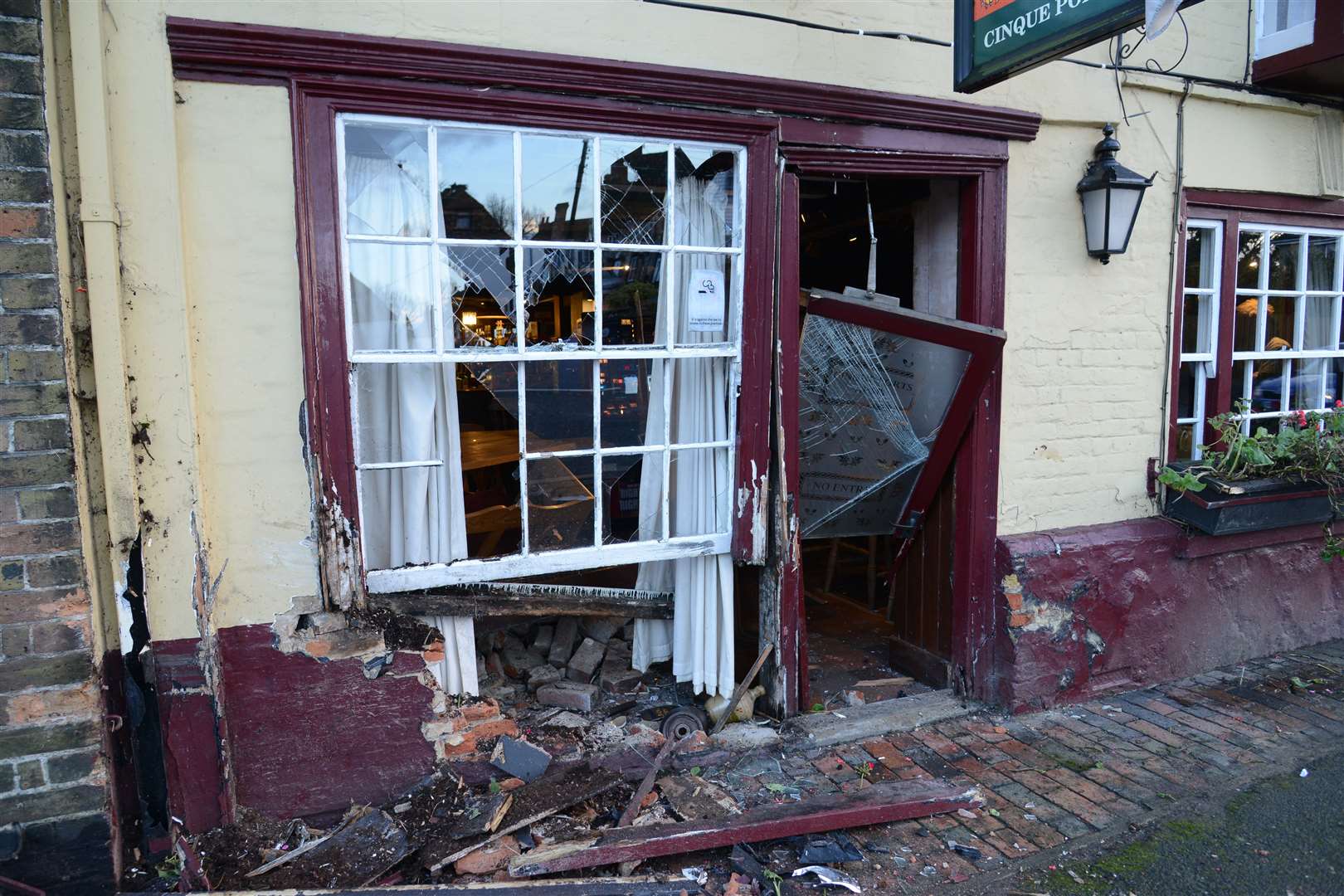 The smashed front of the Cinque Port Arms in New Romney after today's crash.