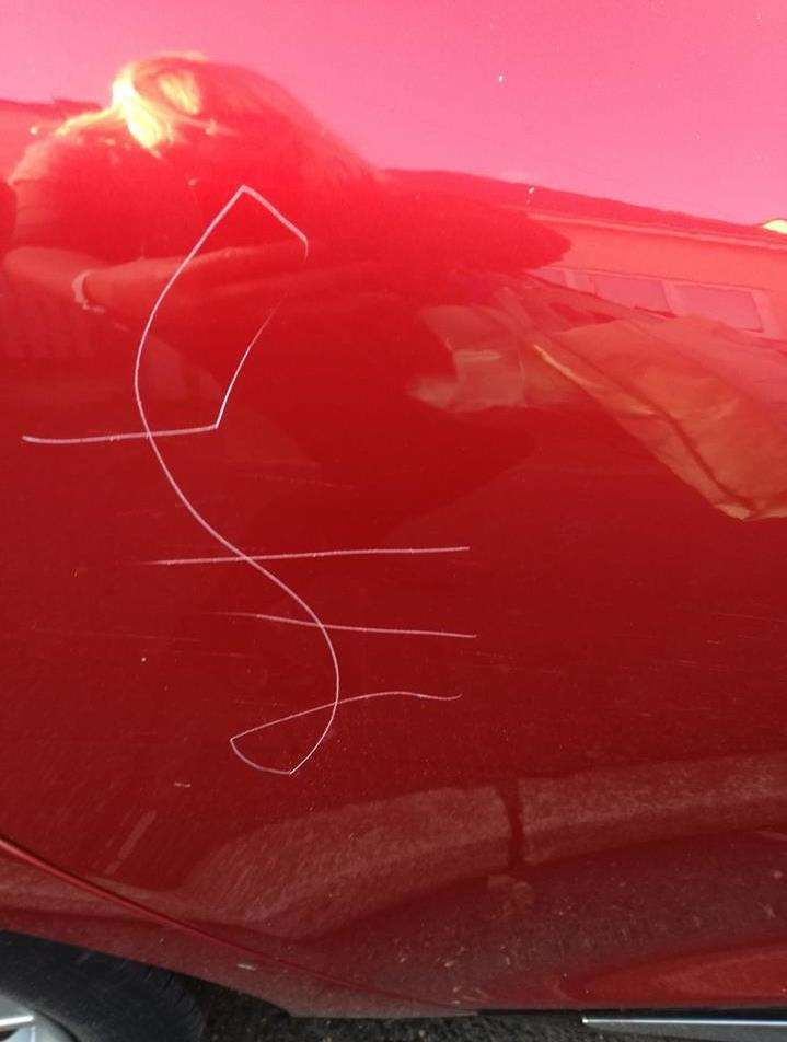 A pound sign was carved into this car in Mill Hill